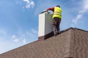 Contractor doing chimney cleaning